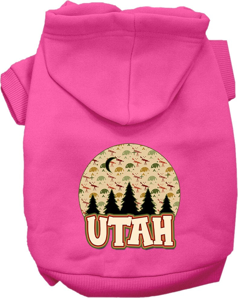 A small to medium pet wearing a cozy screen printed hoodie with a 'Utah Under The Stars' design, showcasing its soft fabric and convenient leash access.