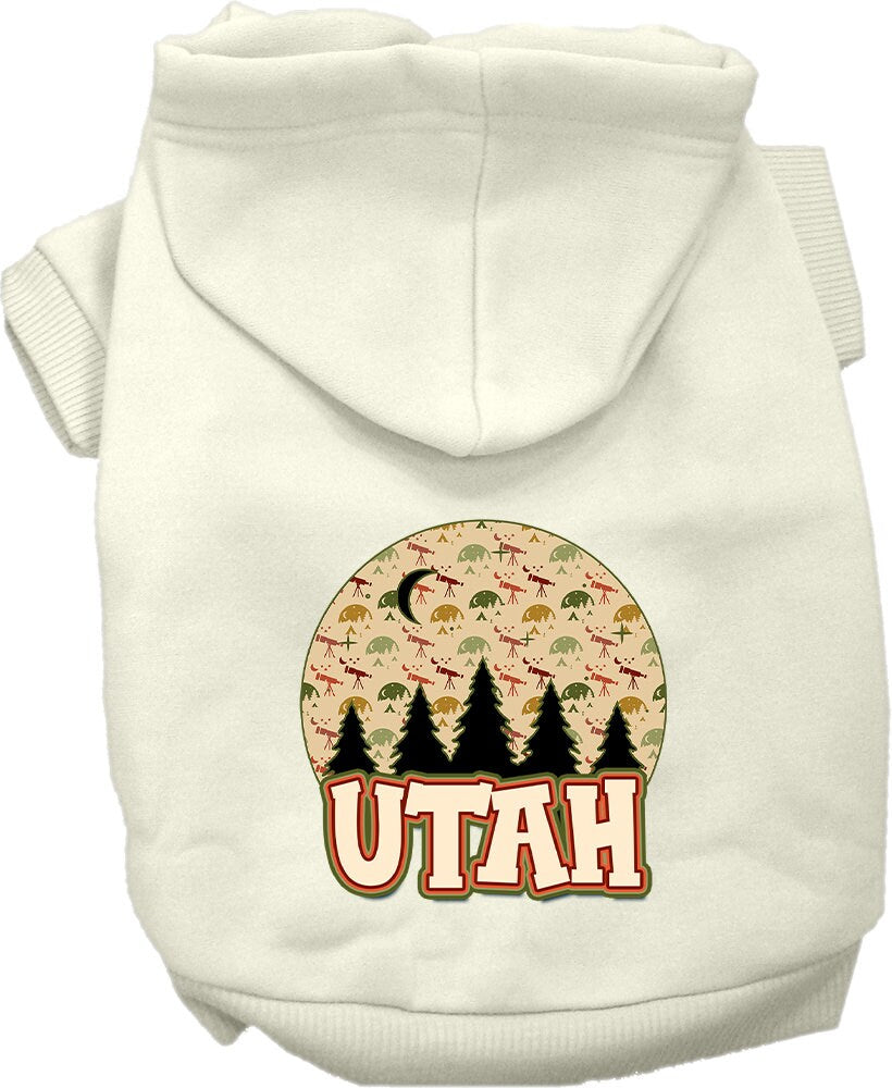 A small to medium pet wearing a cozy screen printed hoodie with a 'Utah Under The Stars' design, showcasing its soft fabric and convenient leash access.