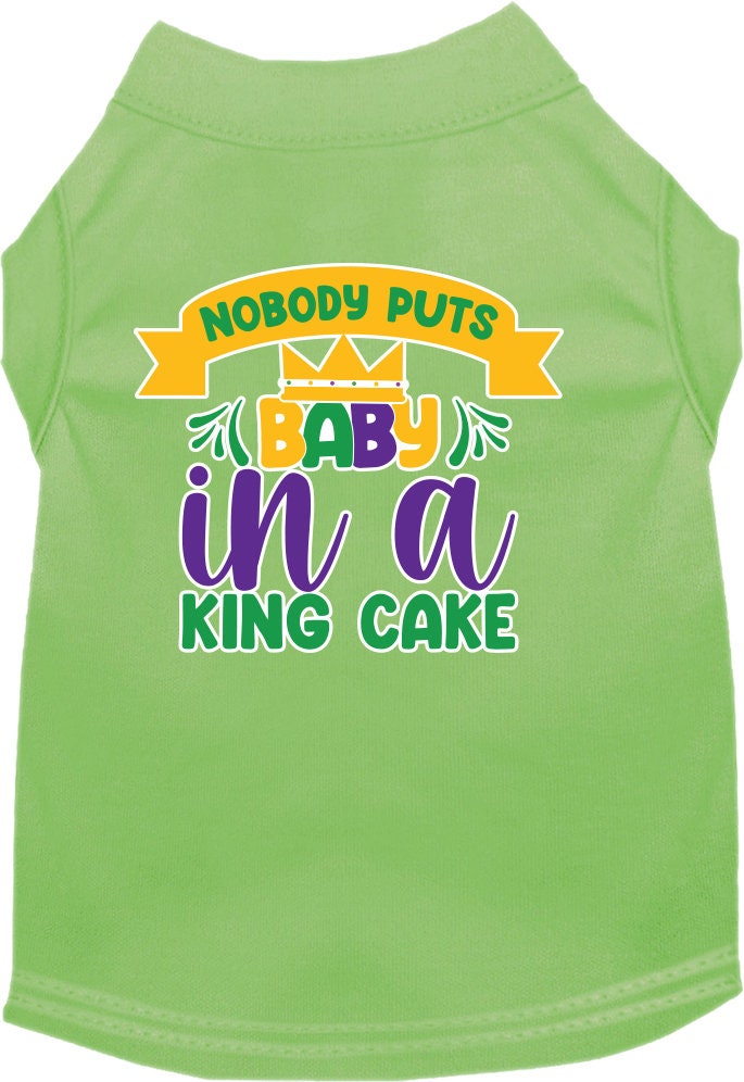 A small to medium pet wearing a soft, screen printed shirt with the phrase 'Nobody Puts Baby In A King Cake', showcasing its unique design and comfortable fit.