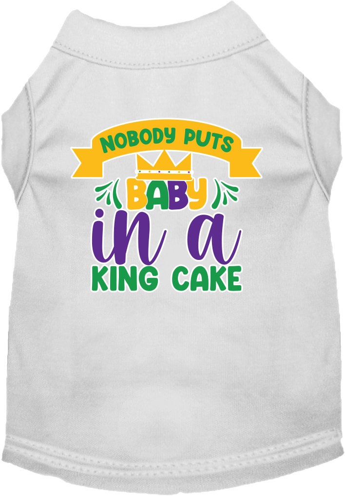 A small to medium pet wearing a soft, screen printed shirt with the phrase 'Nobody Puts Baby In A King Cake', showcasing its unique design and comfortable fit.