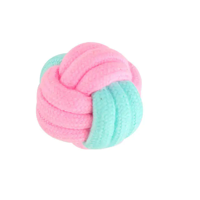 A durable pink cotton rope chew toy designed for dogs, promoting dental health and providing entertainment.