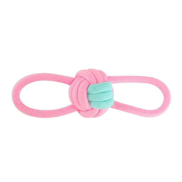 A durable pink cotton rope chew toy designed for dogs, promoting dental health and providing entertainment.