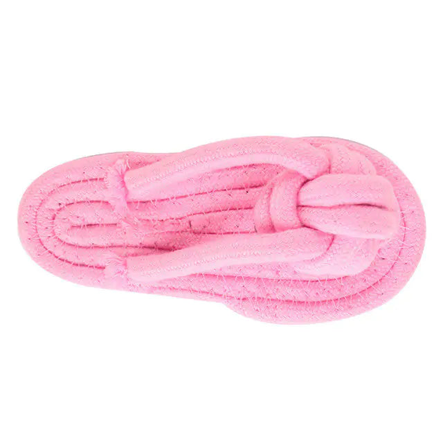 A durable pink cotton rope chew toy designed for dogs, promoting dental health and providing entertainment.
