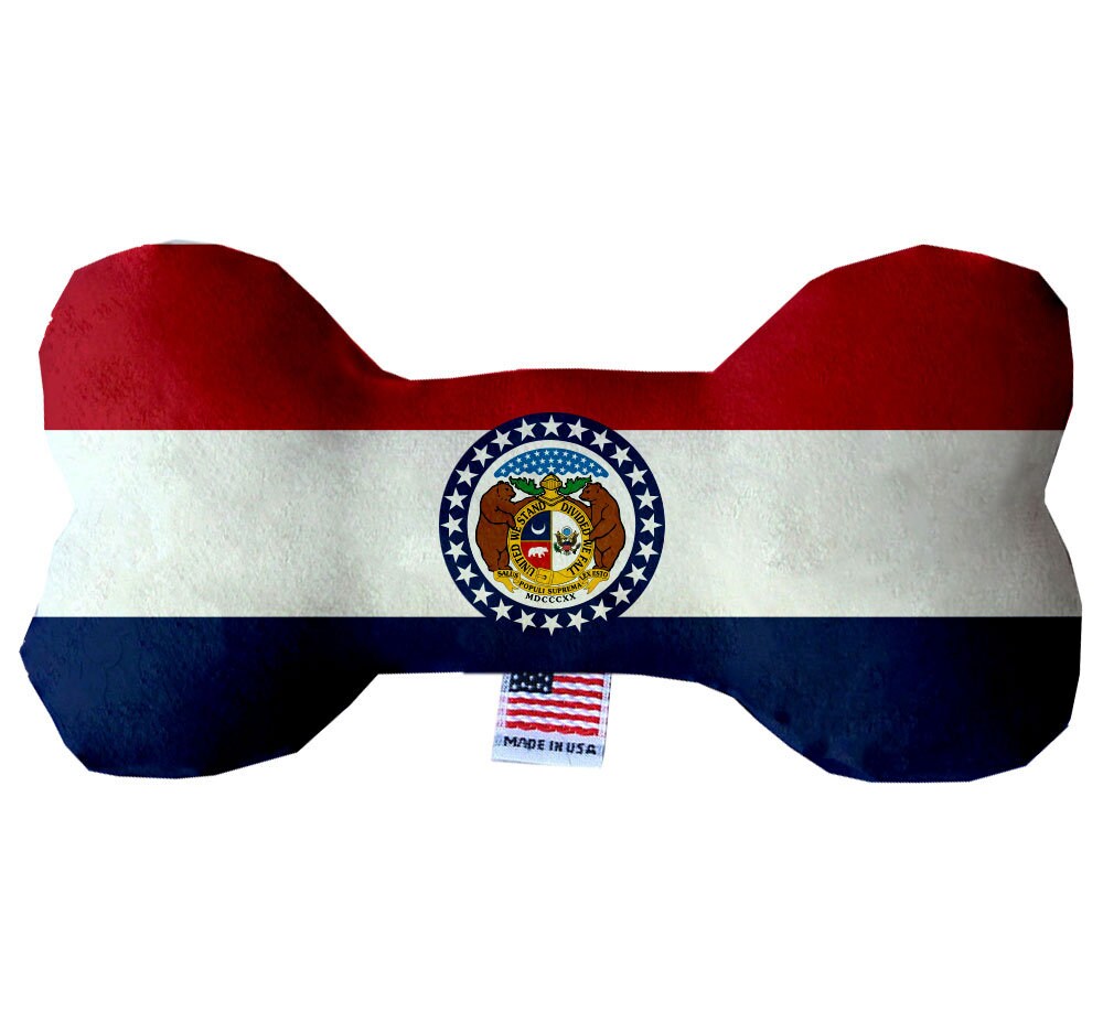 A collection of Missouri State plush bone toys in various patterns and sizes, showcasing their soft texture and squeaker features.