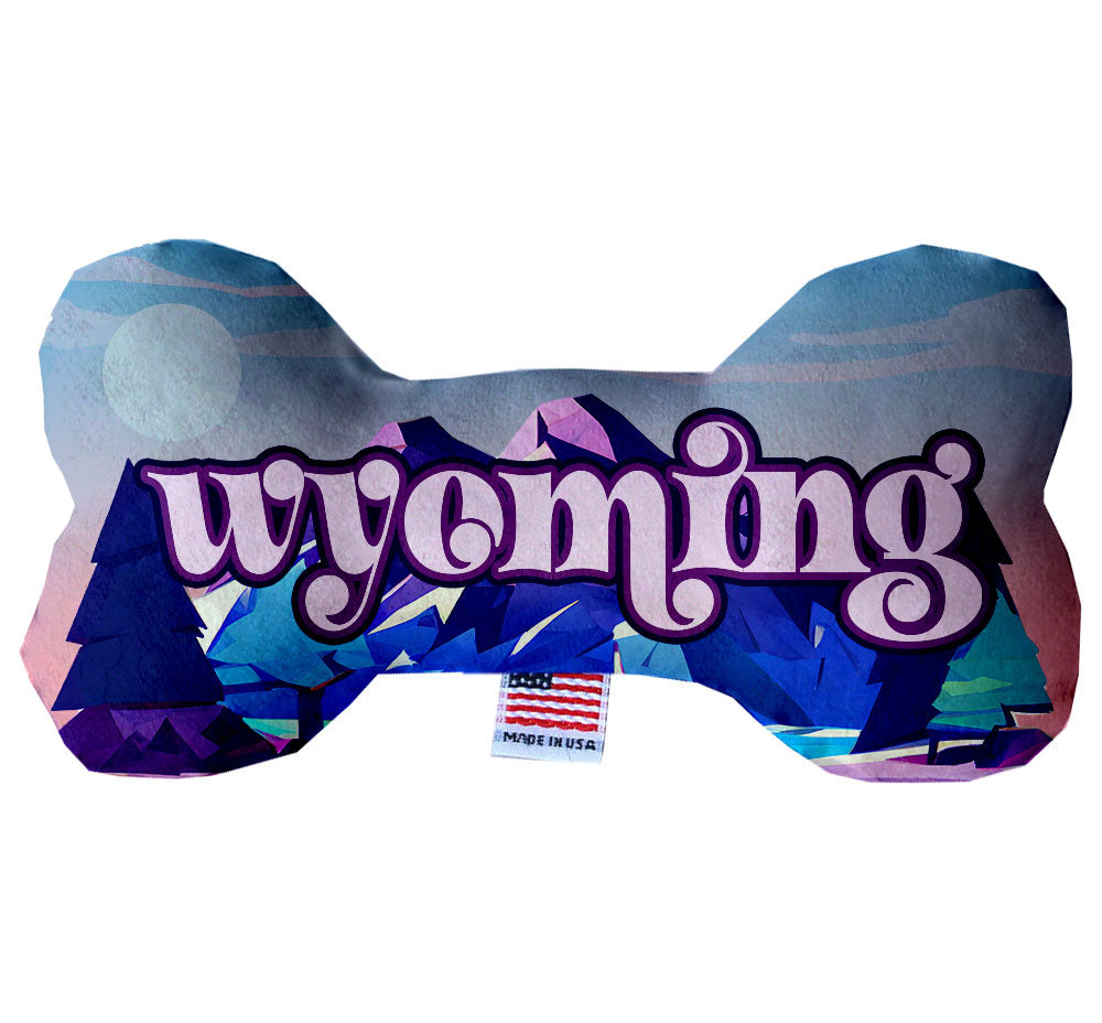 A collection of Wyoming State themed plush bone toys for dogs, showcasing various patterns and sizes, perfect for playtime and cuddling.
