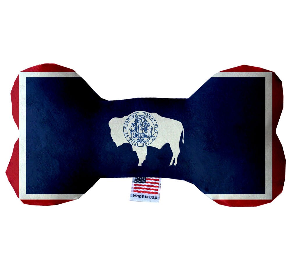 A collection of Wyoming State themed plush bone toys for dogs, showcasing various patterns and sizes, perfect for playtime and cuddling.