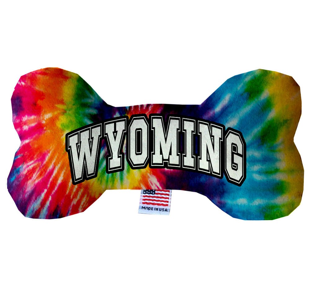 A collection of Wyoming State themed plush bone toys for dogs, showcasing various patterns and sizes, perfect for playtime and cuddling.