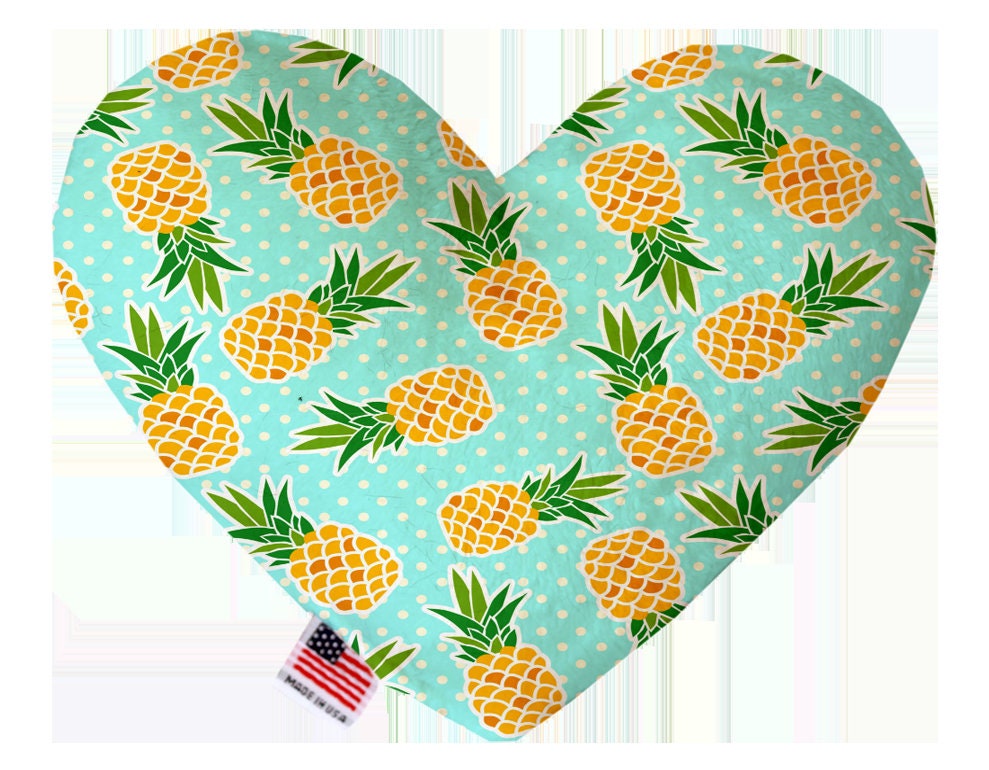 A plush heart and bone toy for dogs, handmade in the USA, featuring vibrant patterns and soft texture, perfect for playtime and cuddling.