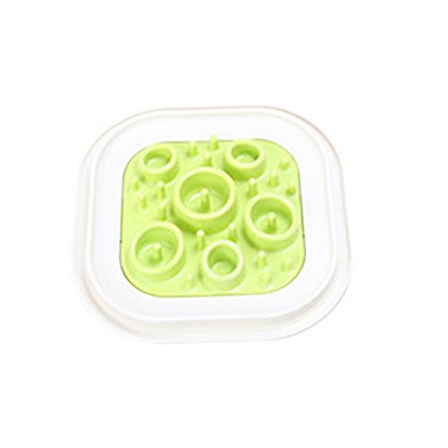 Portable pet feeder bowls in green, blue, and purple, designed to slow down eating for dogs and cats.