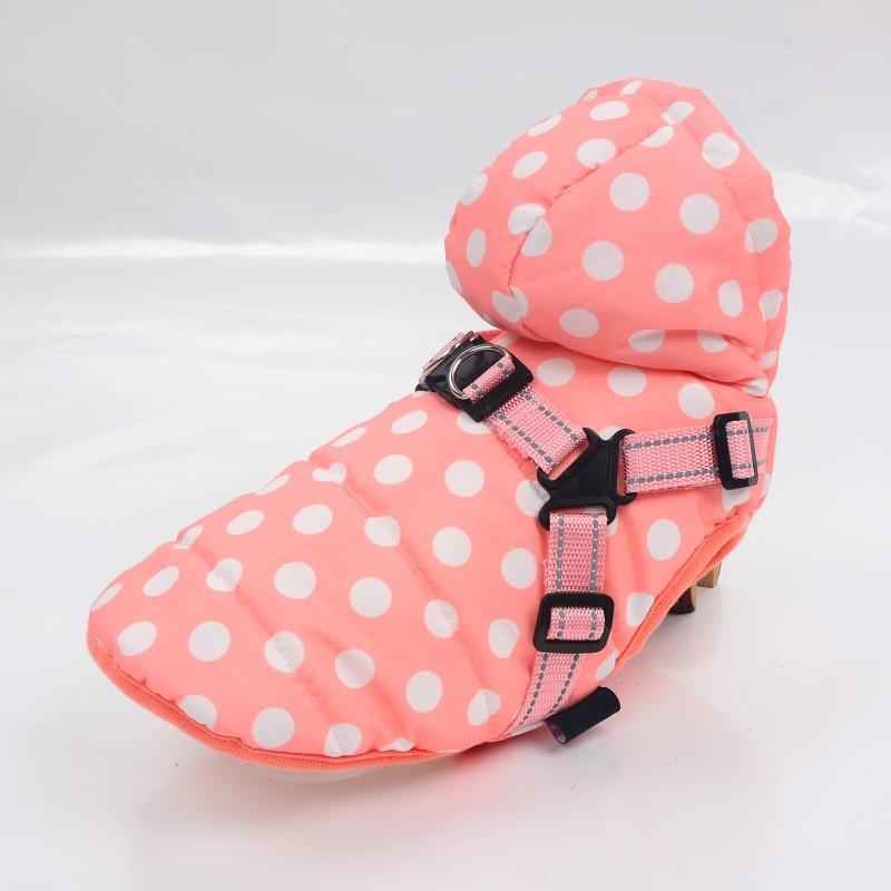 A stylish winter skiing jacket coat for puppies, featuring an adjustable chest strap and a vibrant print design, perfect for outdoor walks.