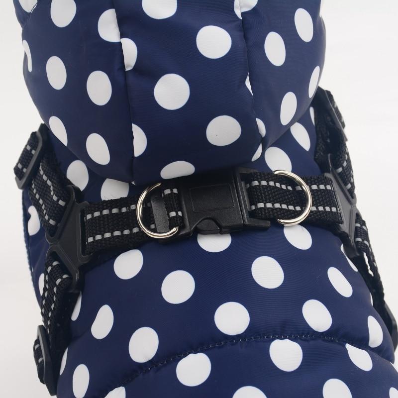 A stylish winter skiing jacket coat for puppies, featuring an adjustable chest strap and a vibrant print design, perfect for outdoor walks.