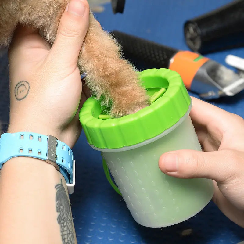 A Pet Wash Cup designed for cleaning pet paws, featuring soft brushes and a durable silicone body, ideal for keeping floors clean.