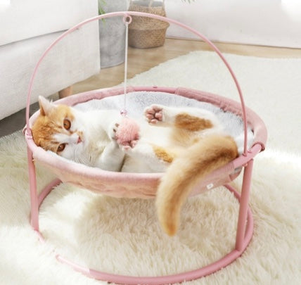 A cozy and stylish pets bed designed for both winter and summer, featuring a soft hammock and a pill toy, perfect for cats of all ages.