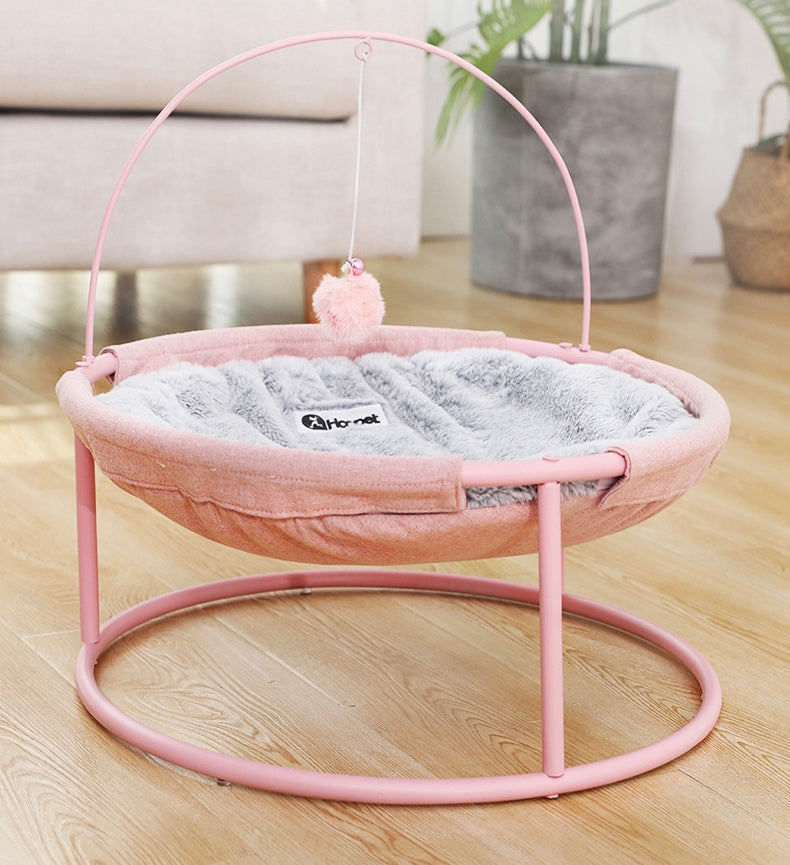 A cozy and stylish pets bed designed for both winter and summer, featuring a soft hammock and a pill toy, perfect for cats of all ages.