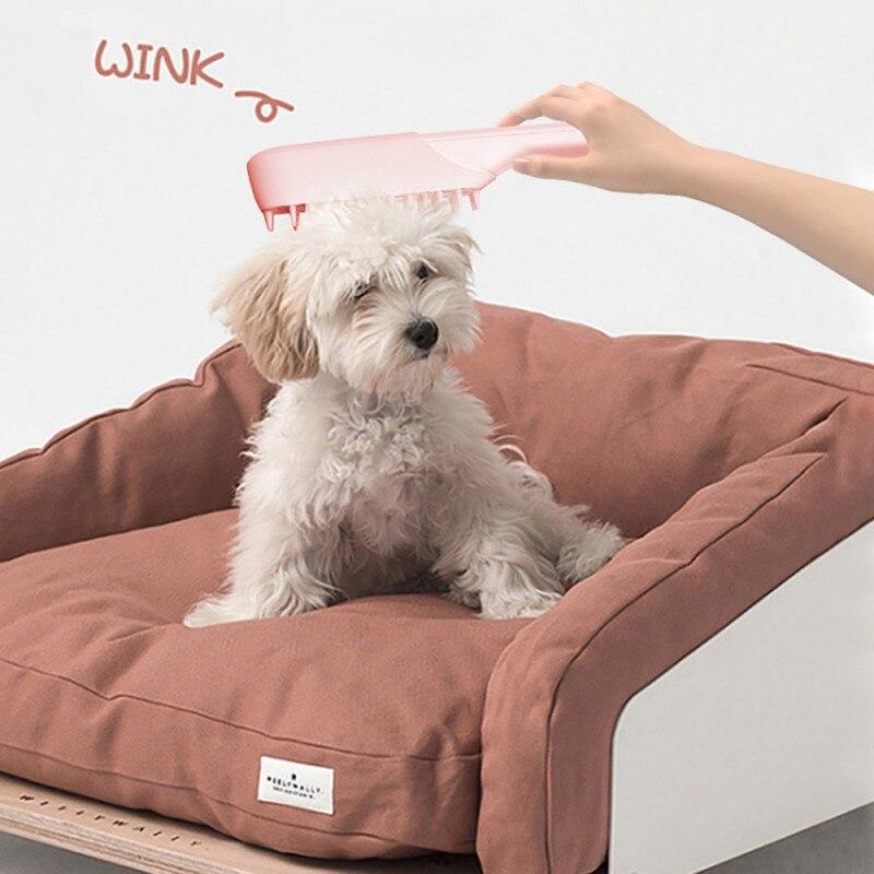 Pets Comb Massage Brush designed for pet grooming, featuring ergonomic design and gentle bristles for effective hair removal and massage.