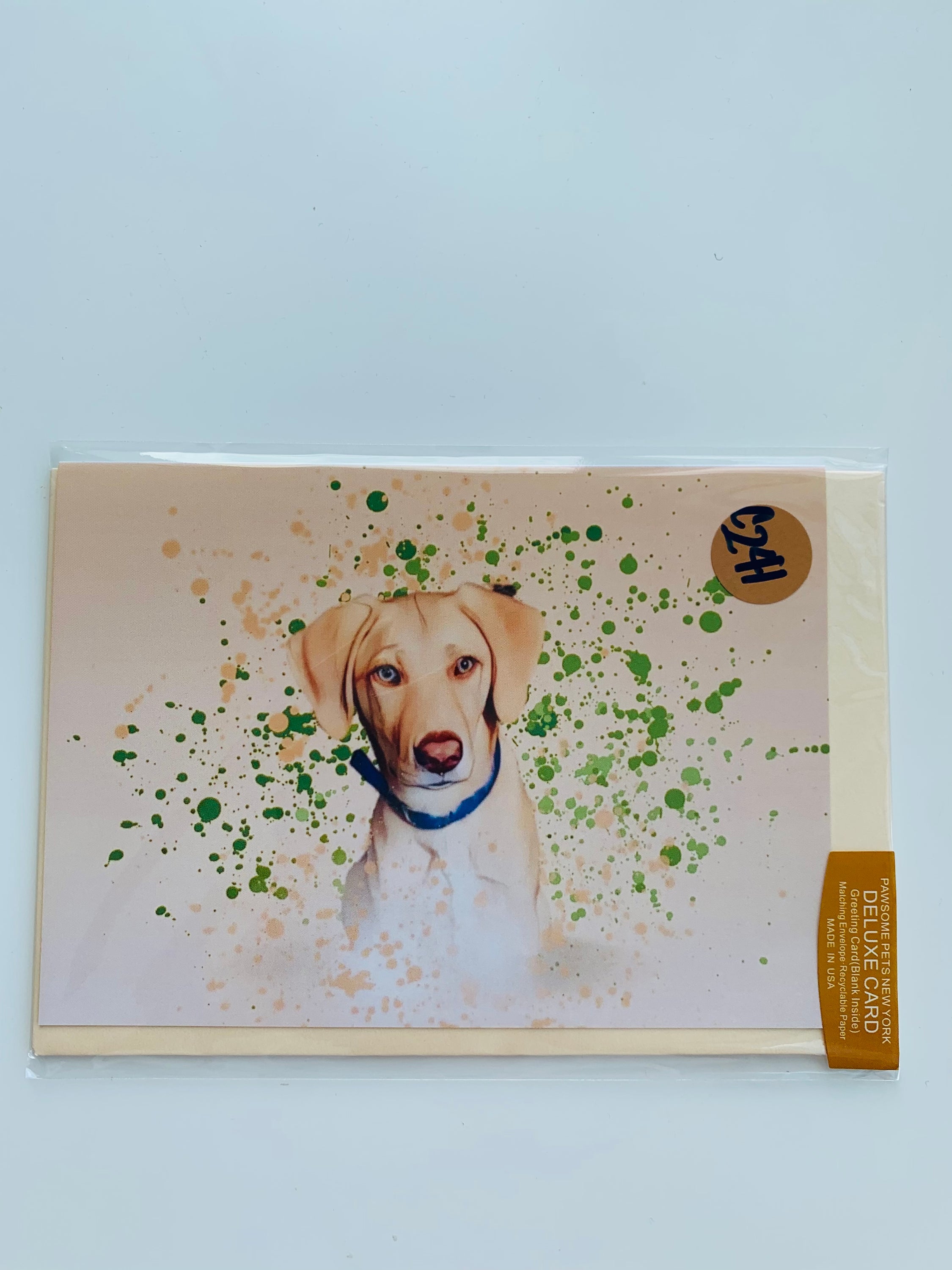 A folded greeting card featuring a hand-painted design of pets, printed on smooth white cardstock with a plain craft envelope.