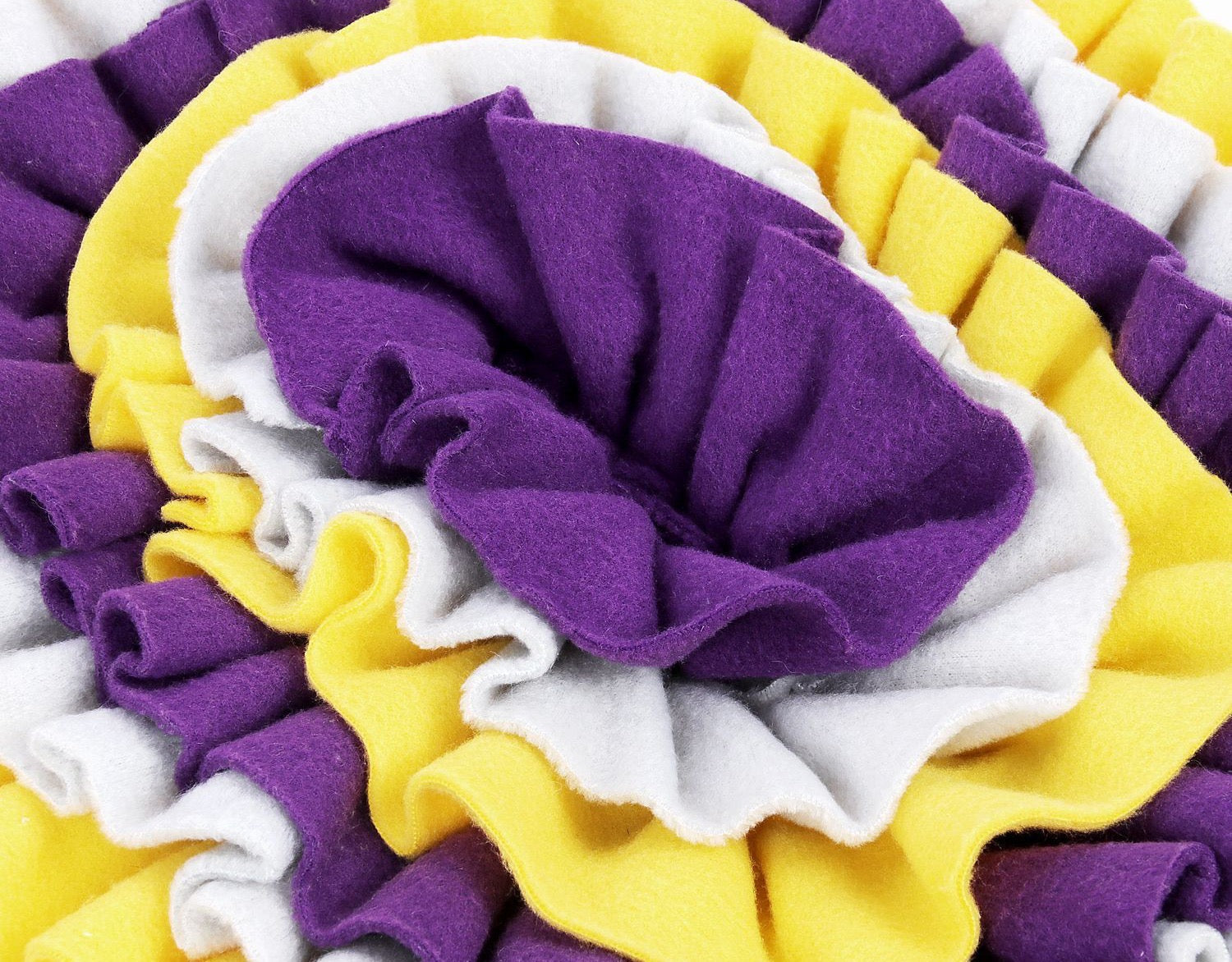 Purple and yellow floral snuffle mat designed for pets, featuring a non-slip base and rotating top for interactive feeding.