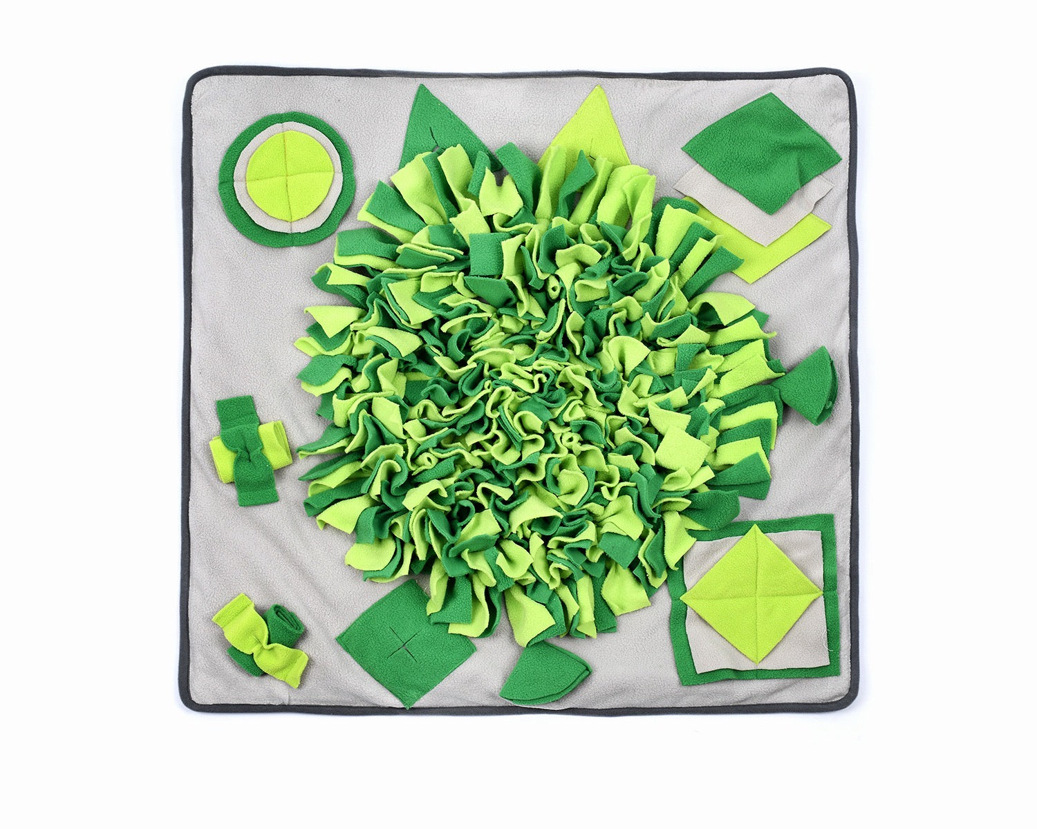 A vibrant green snuffle mat designed for pets, featuring various textures and a rotating top for interactive play and slow feeding.