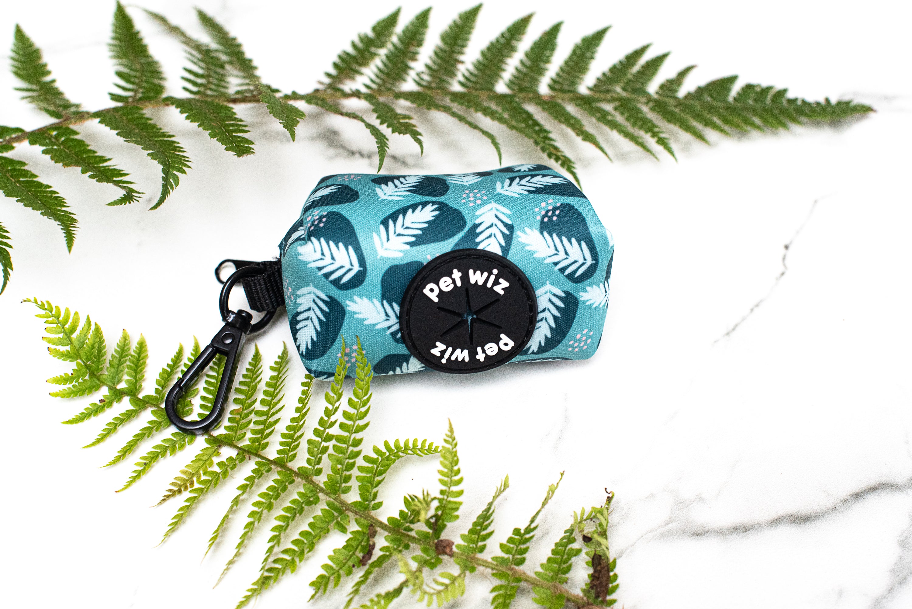 Stylish poop bag holder featuring five unique patterns, designed for convenience and easy access during dog walks.