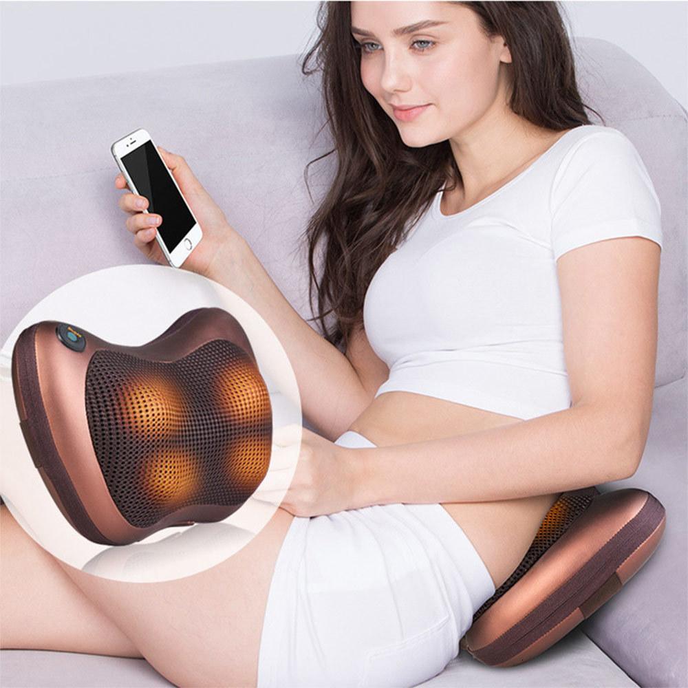 Portable 4 heads massage pillow in black, designed for neck and body relaxation with ergonomic shape and infrared warming technology.