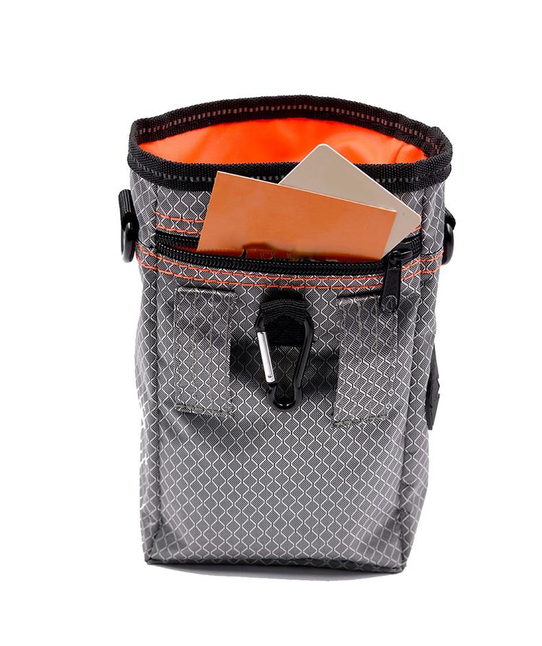 Portable Dog Training Bag made of durable Oxford cloth, featuring multiple pockets for treats, snacks, and poop bags, ideal for outdoor use.
