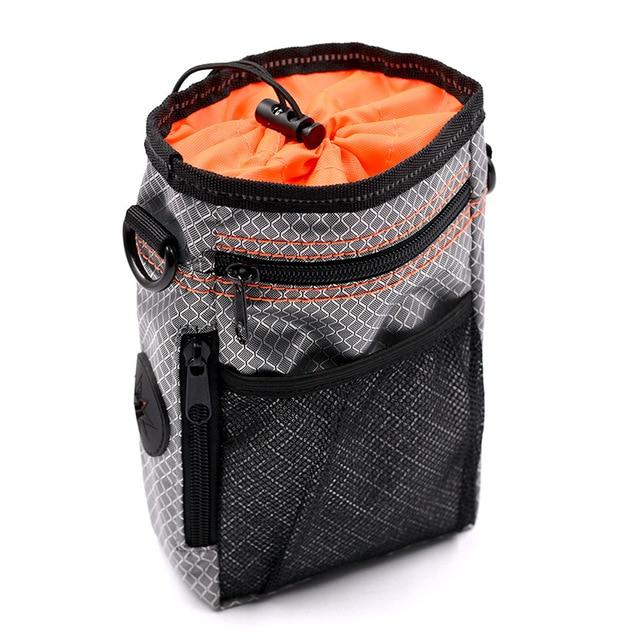 Portable Dog Training Bag made of durable Oxford cloth, featuring multiple pockets for treats, snacks, and poop bags, ideal for outdoor use.