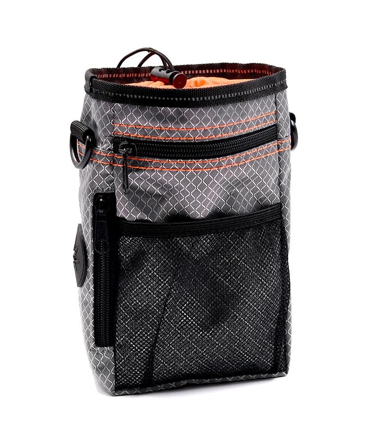 Portable Dog Training Bag made of durable Oxford cloth, featuring multiple pockets for treats, snacks, and poop bags, ideal for outdoor use.