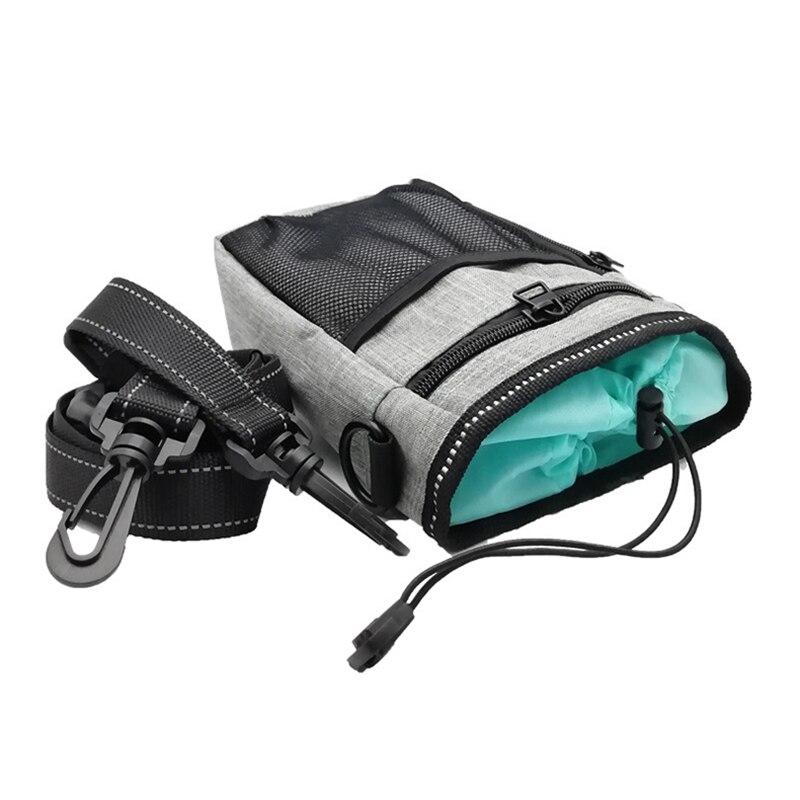 Portable Dog Training Bag made of durable Oxford cloth, featuring multiple pockets for treats, snacks, and poop bags, ideal for outdoor use.