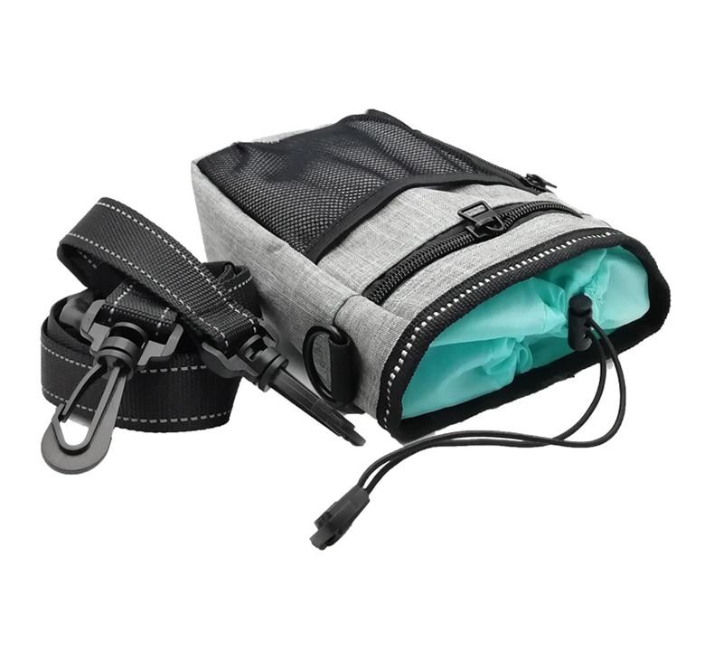 Portable Dog Training Bag made of durable Oxford cloth, featuring multiple pockets for treats, snacks, and poop bags, ideal for outdoor use.