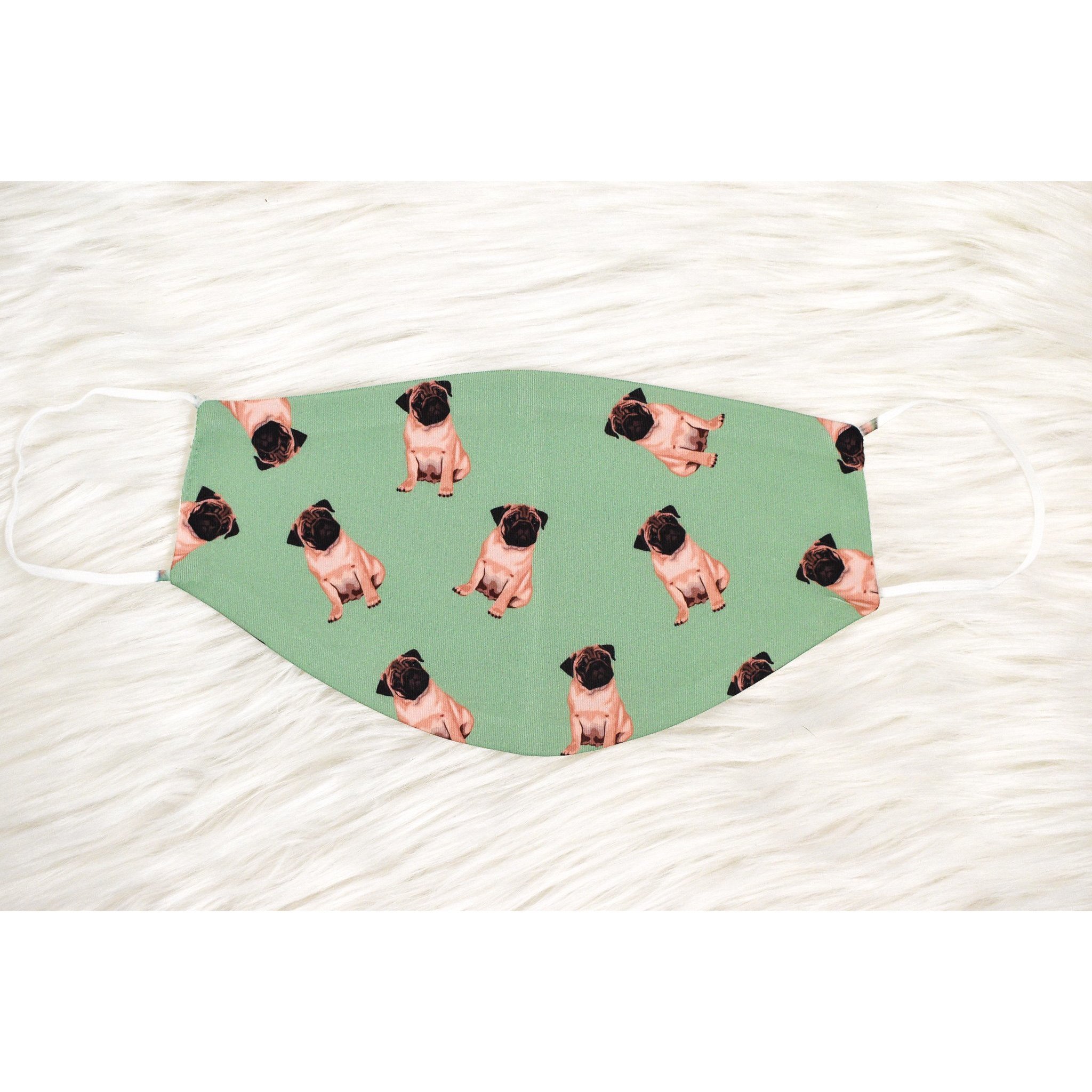 A handmade pug face cover featuring a cute pug design, made from breathable polyester and organic cotton, suitable for adults.