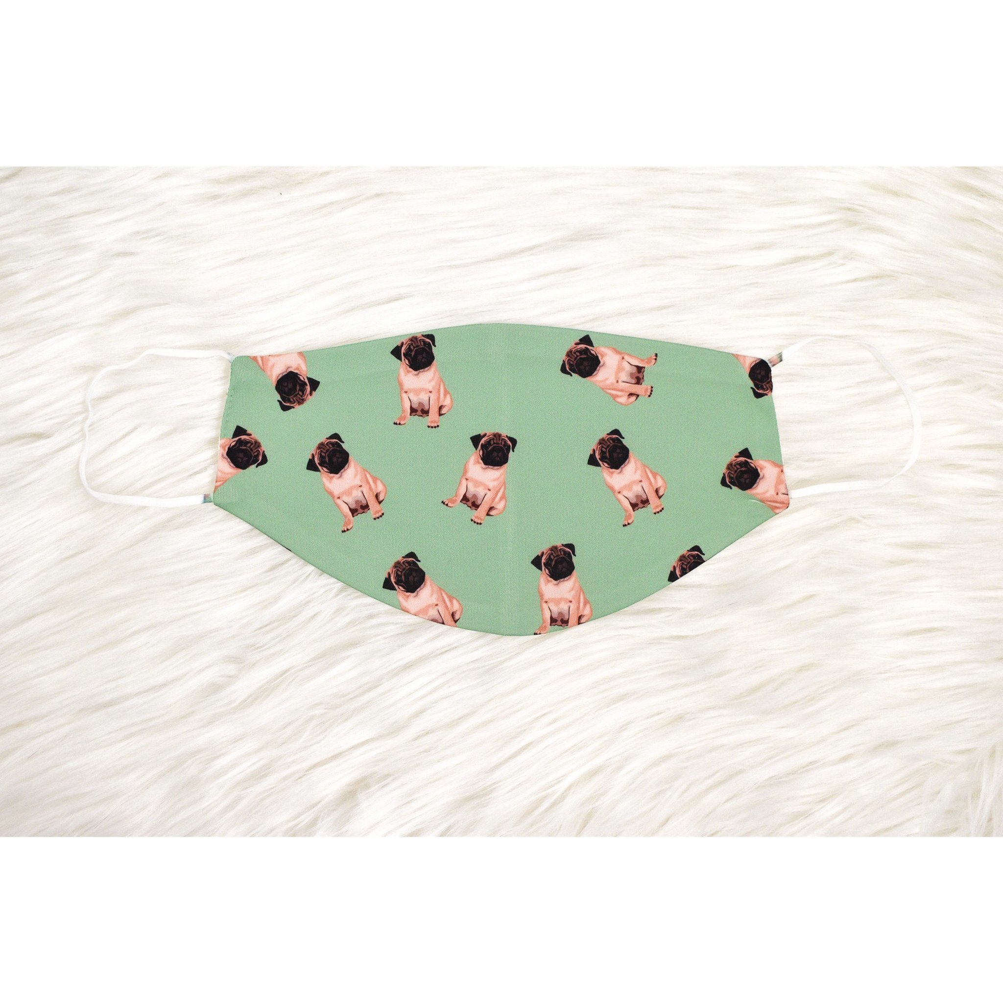 A handmade pug face cover featuring a cute pug design, made from breathable polyester and organic cotton, suitable for adults.