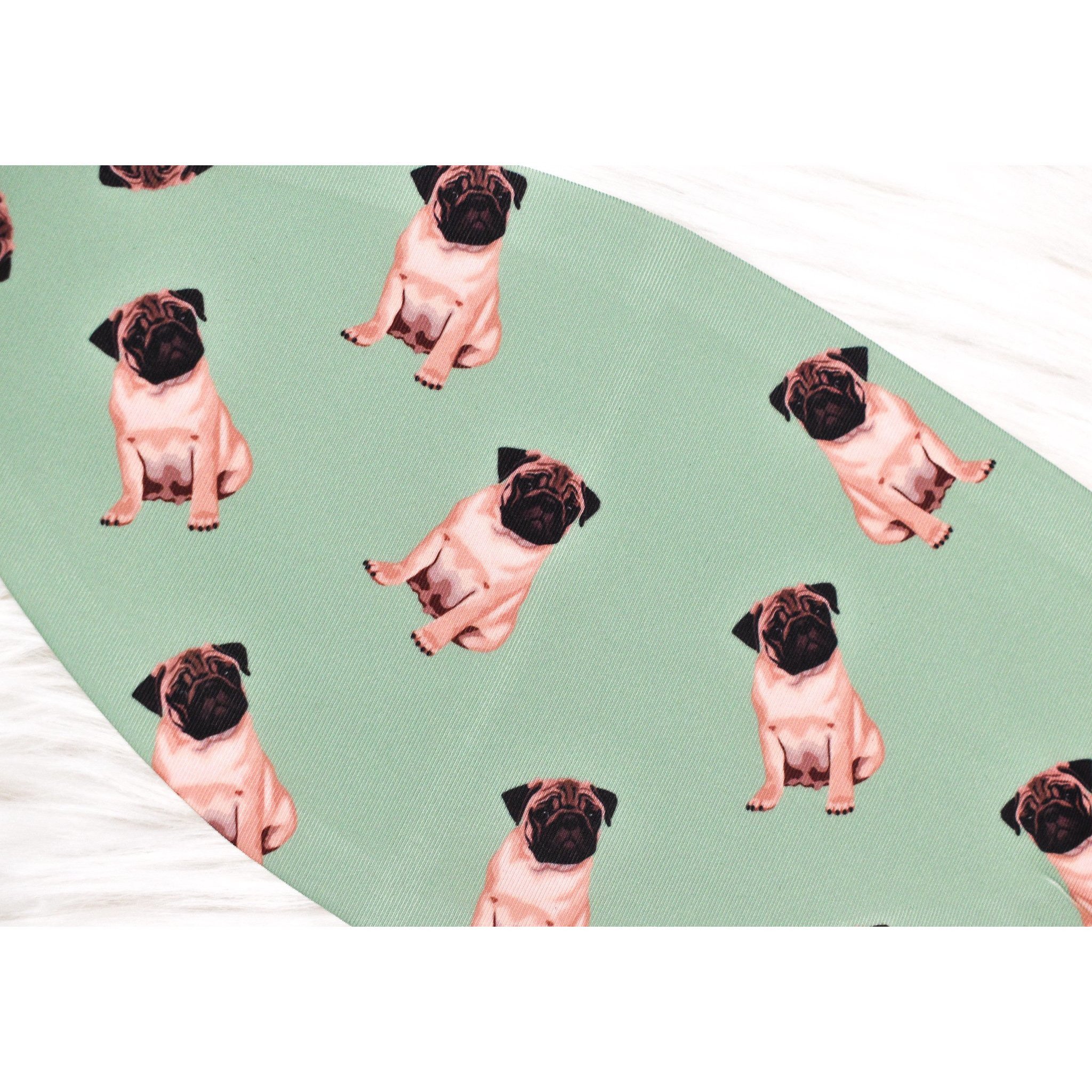 A handmade pug face cover featuring a cute pug design, made from breathable polyester and organic cotton, suitable for adults.