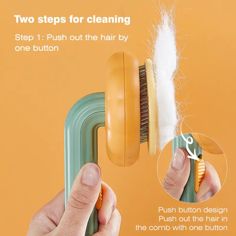 Pumpkin Pet Brush with stainless steel blade and self-cleaning feature, designed for effective grooming of cats and dogs.