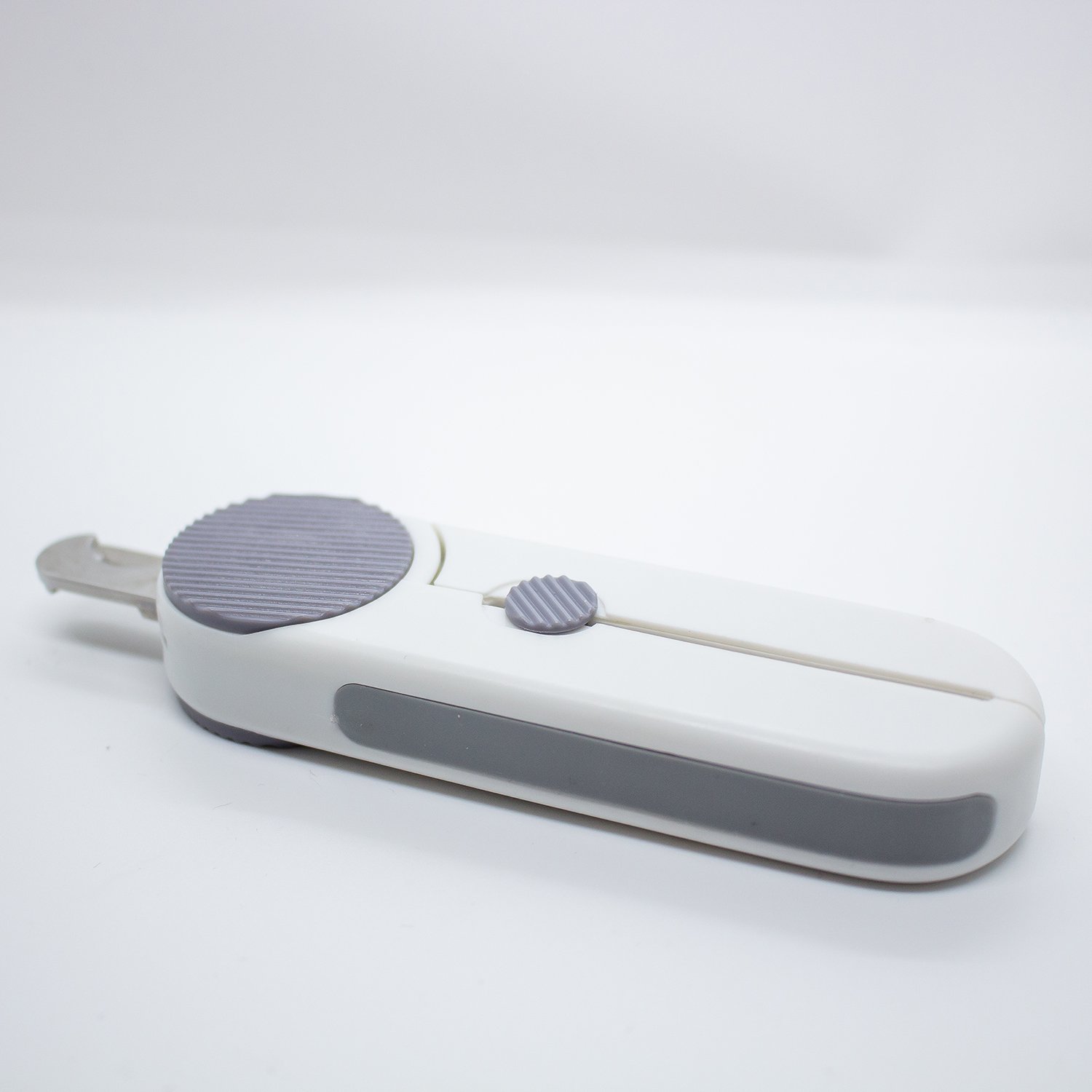 Pureclip LED Clipper in grey with ergonomic design and built-in LED light for safe pet nail grooming.