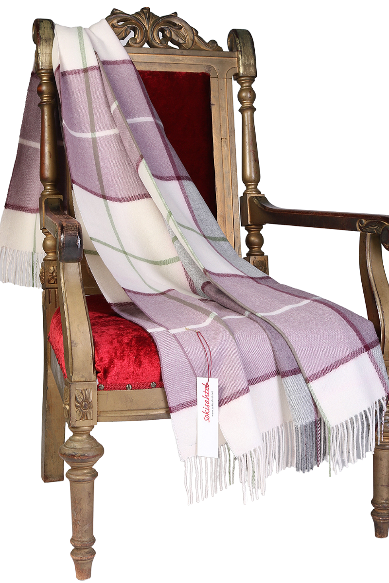 Purple checkered alpaca wool plaid showcasing luxurious texture and elegant design, perfect for winter warmth.