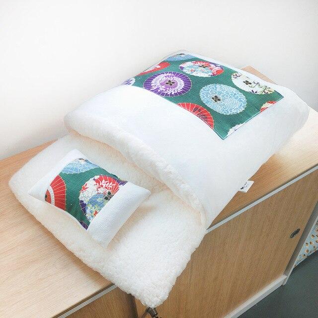 A cozy removable dog cat bed sleeping bag in soft pp cotton, perfect for winter warmth, available in multiple sizes.