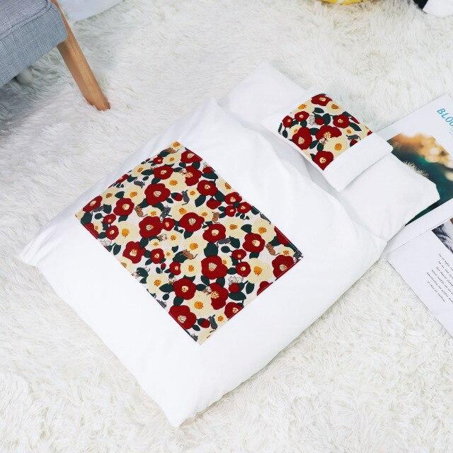 A cozy removable dog cat bed sleeping bag in soft pp cotton, perfect for winter warmth, available in multiple sizes.