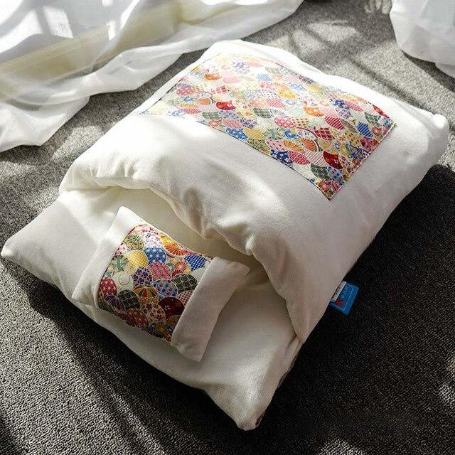 A cozy removable dog cat bed sleeping bag in soft pp cotton, perfect for winter warmth, available in multiple sizes.