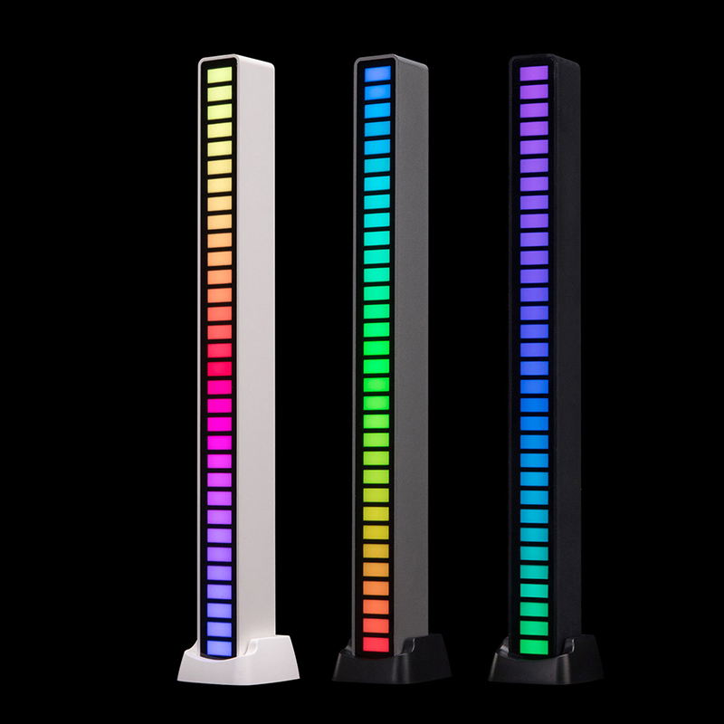 RGB LED Music Sound Control light in white, silver, and black colors, showcasing its sleek design and compact size.