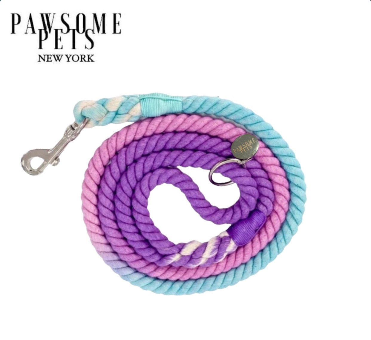 A vibrant sapphire-colored rope leash made of 100% cotton, featuring luxe hardware and a matching dog charm.