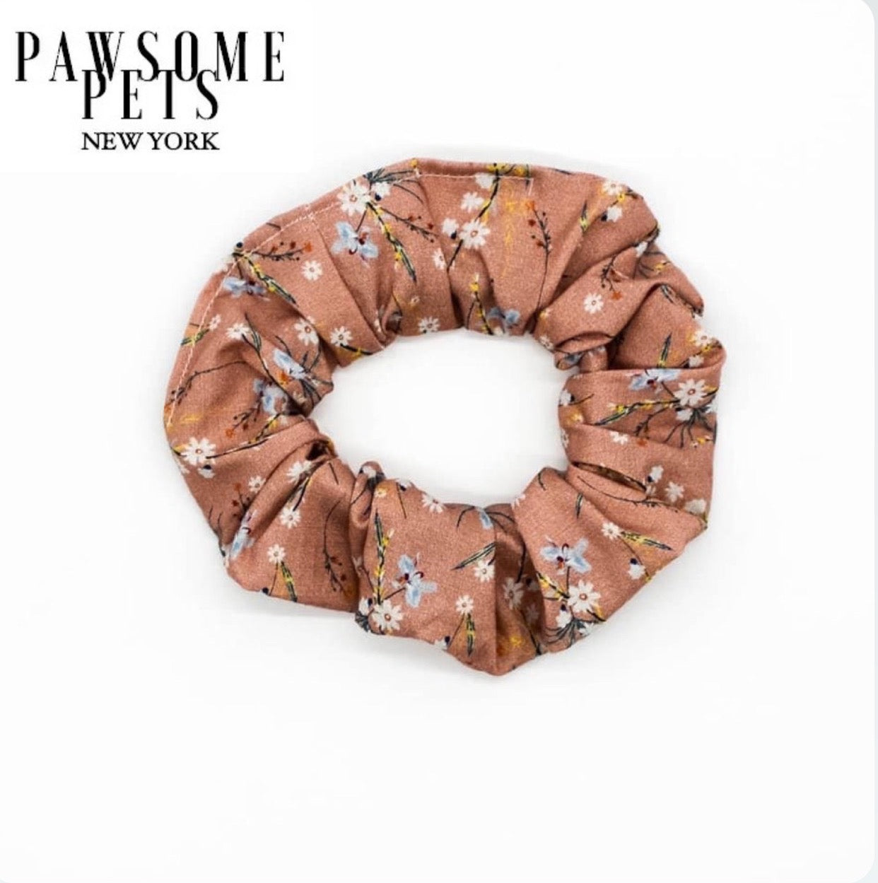 Floral pink scrunchies made from organic cotton, showcasing a stylish and comfortable design.