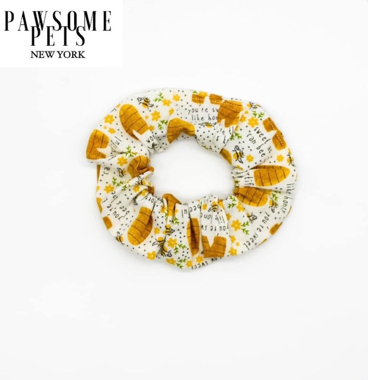 A collection of stylish SCRUNCHIES - OH MY BEE made from organic cotton, showcasing various colors and patterns, perfect for hair styling.