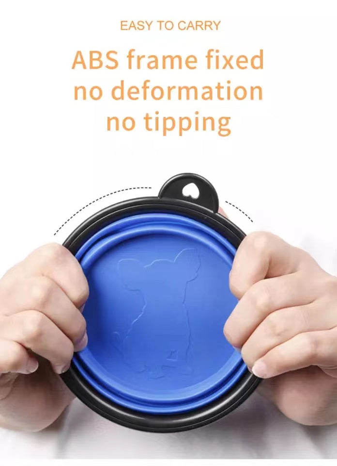 Silicone dog feeder bowl in vibrant color, featuring a carabiner for easy attachment, ideal for travel and outdoor use.