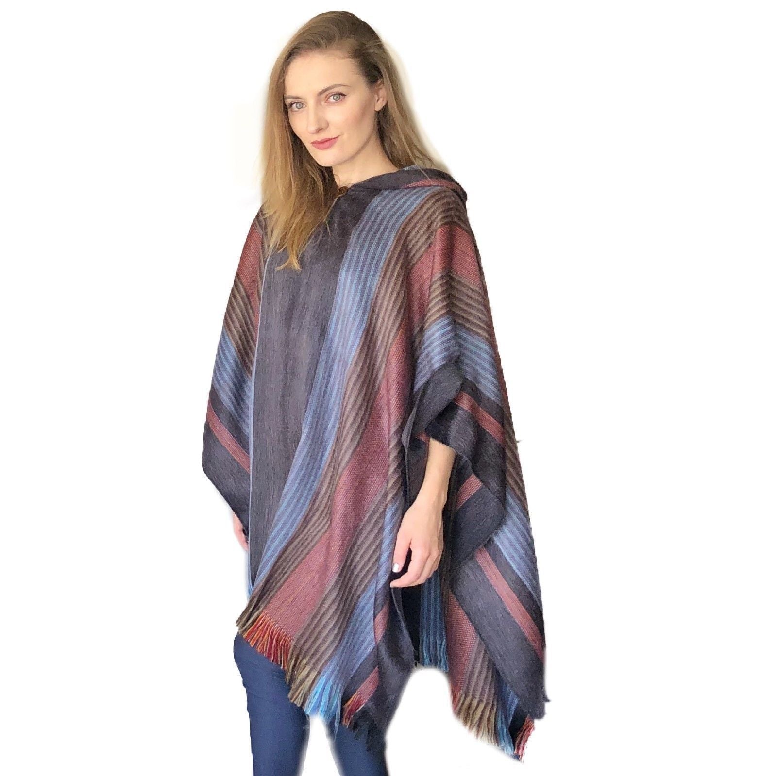 A beautifully crafted Six Band Alpaca Poncho showcasing intricate patterns of colored bands, made from 80% alpaca wool.