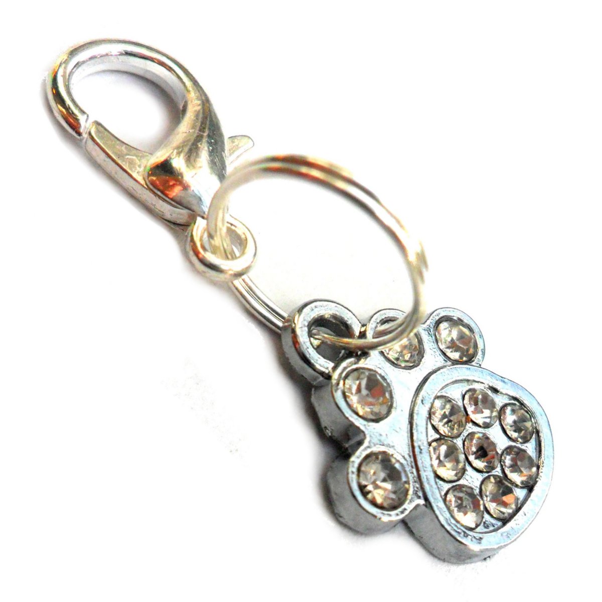 Small rhinestone paw charms for dogs and cats, featuring clear sparkling rhinestones and a lobster clasp for easy attachment.