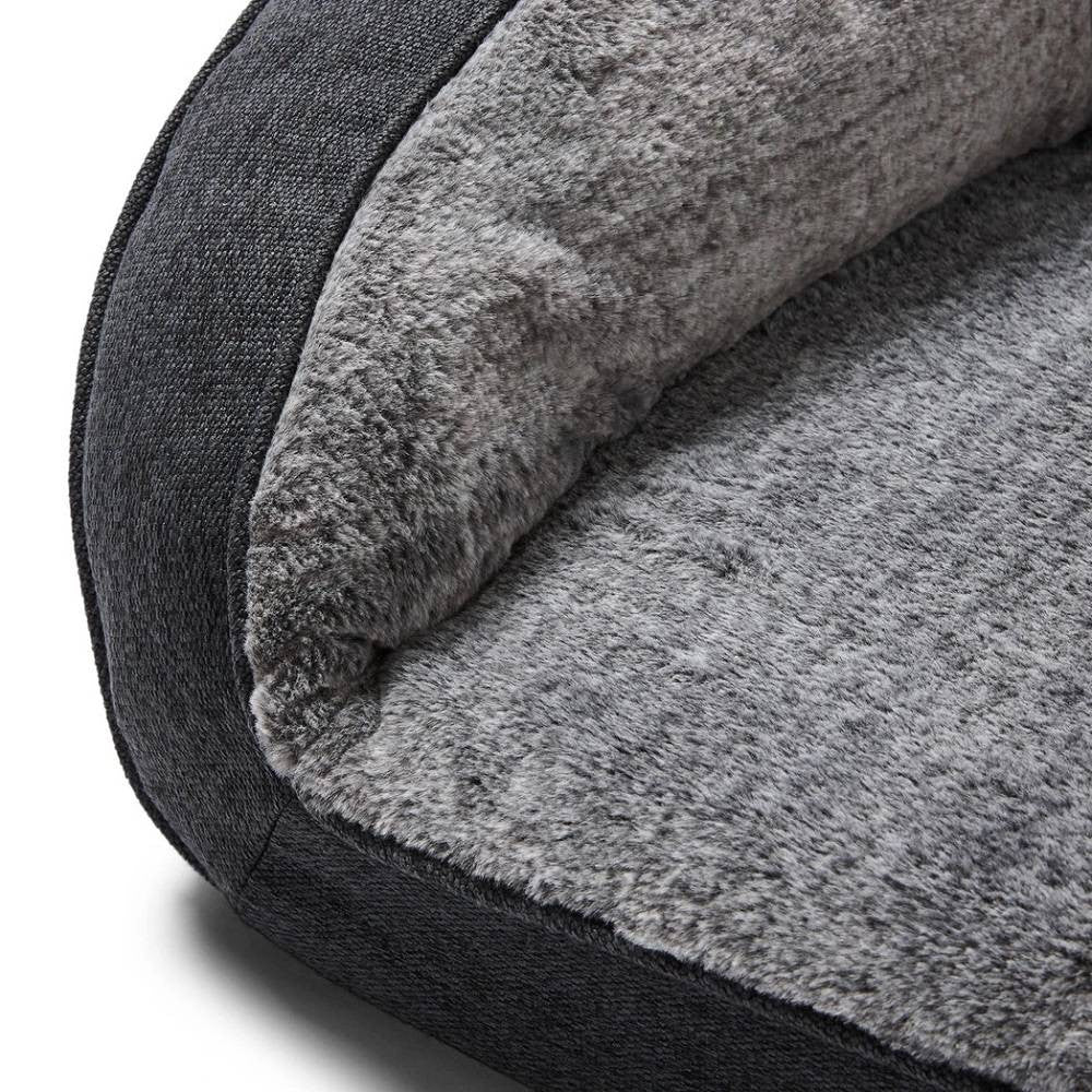 Snooza Futon Orthopaedic Dog Sofa in Chinchilla color, featuring plush bolstered walls and a comfortable foam base, perfect for dogs of all sizes.