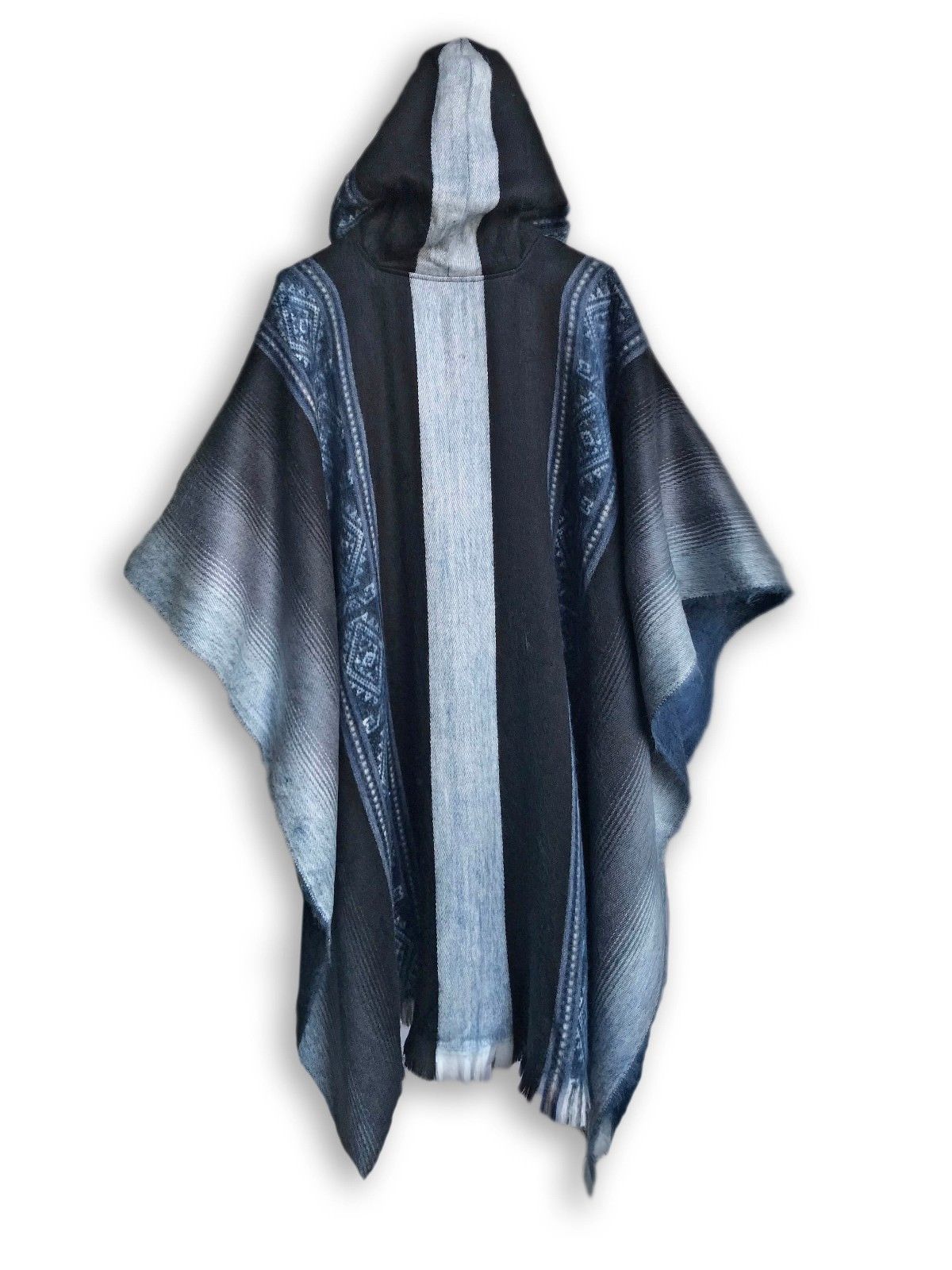 A soft blues and grays alpaca poncho draped elegantly, showcasing its luxurious texture and calming colors.