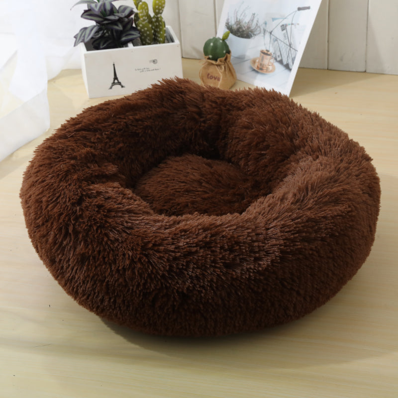 Soft Calming Donut Bed for Dogs and Cats, featuring a plush, fluffy design with raised edges for comfort and security.