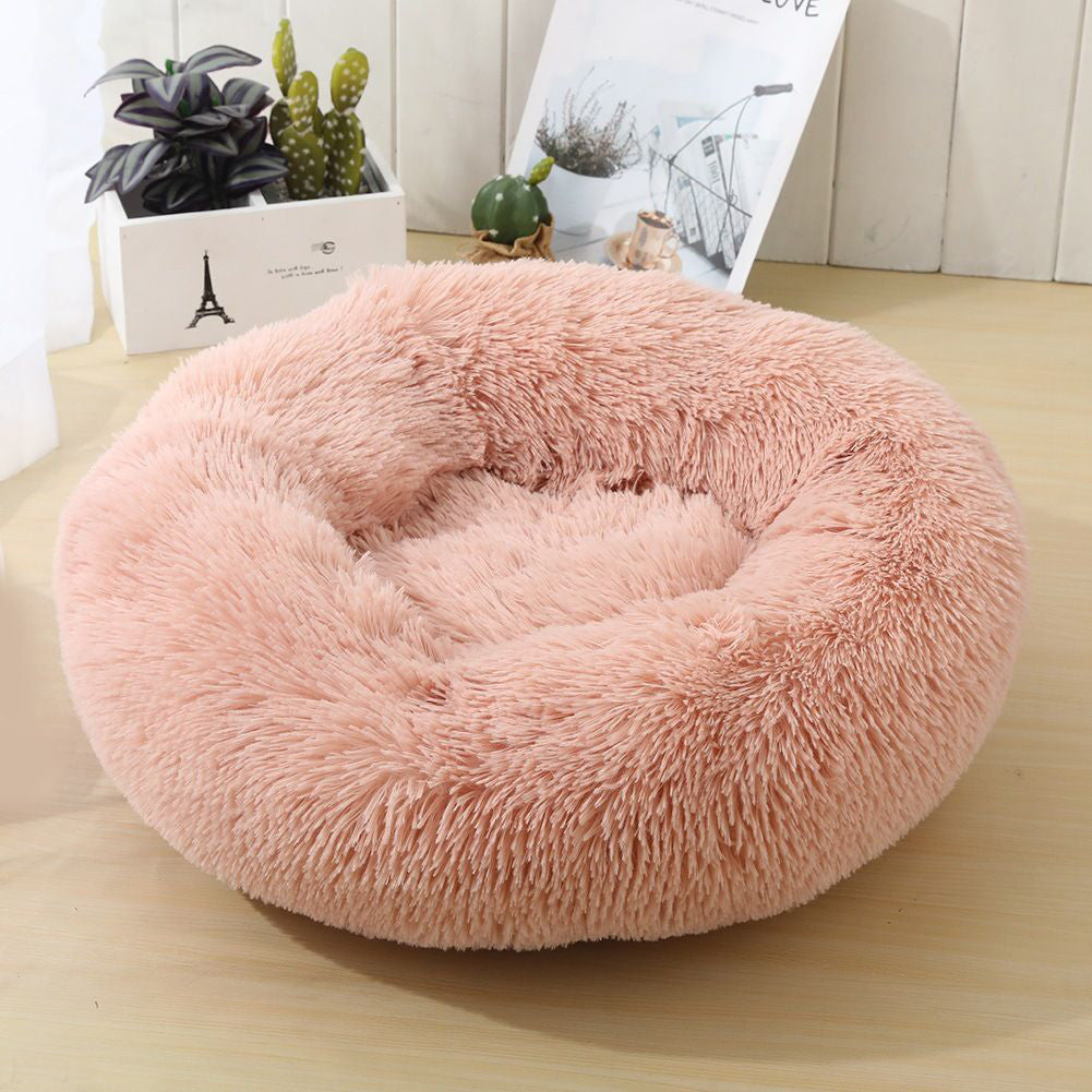Soft Calming Donut Bed for Dogs and Cats, featuring a plush, fluffy design with raised edges for comfort and security.