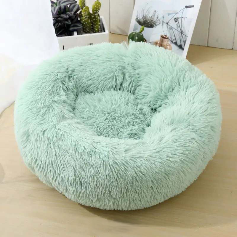 Soft Calming Donut Bed for Dogs and Cats, featuring a plush, fluffy design with raised edges for comfort and security.